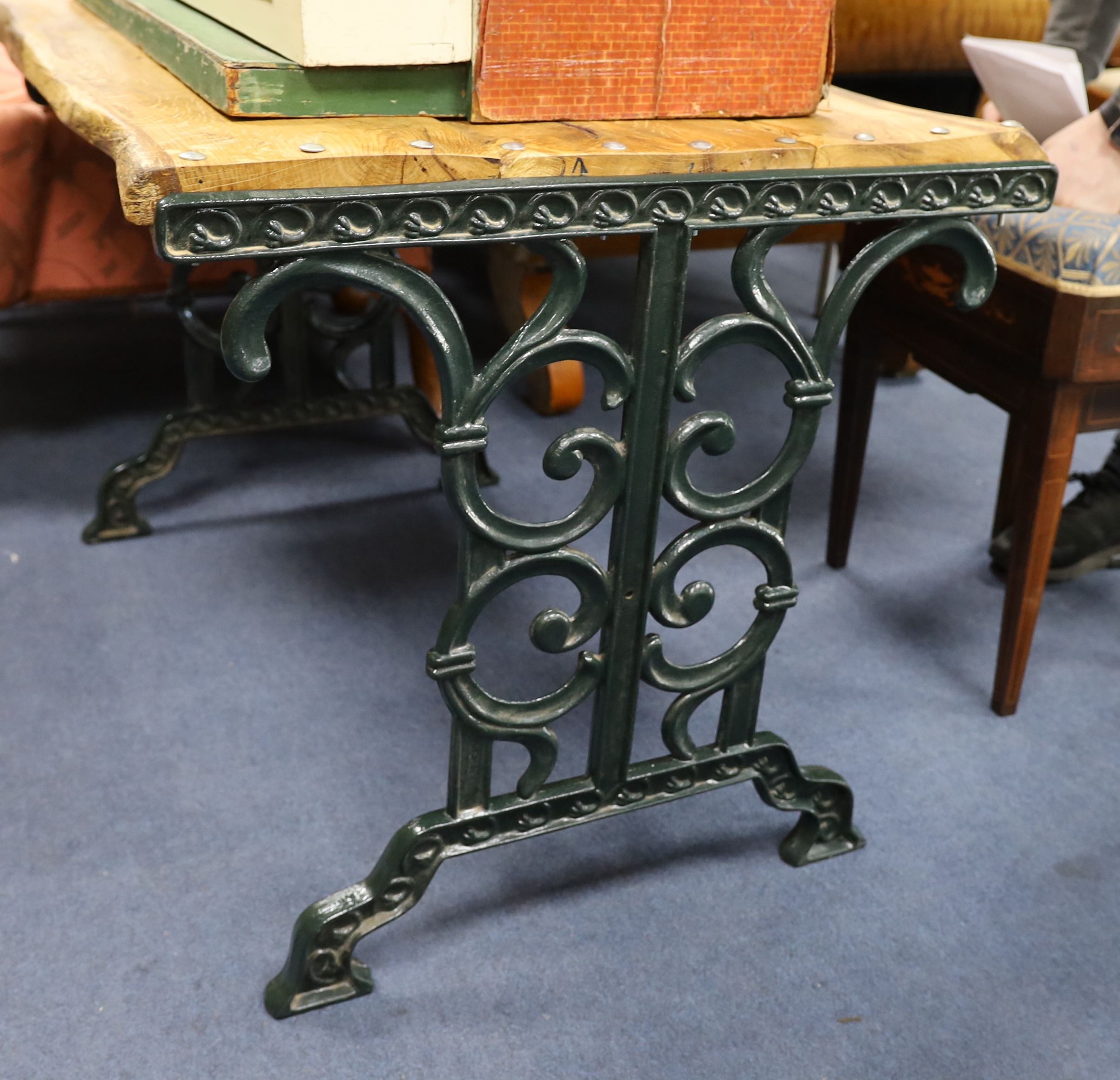 A Victorian style painted cast iron garden table with waney edge top, width 102cm, depth 70cm, height 68cm